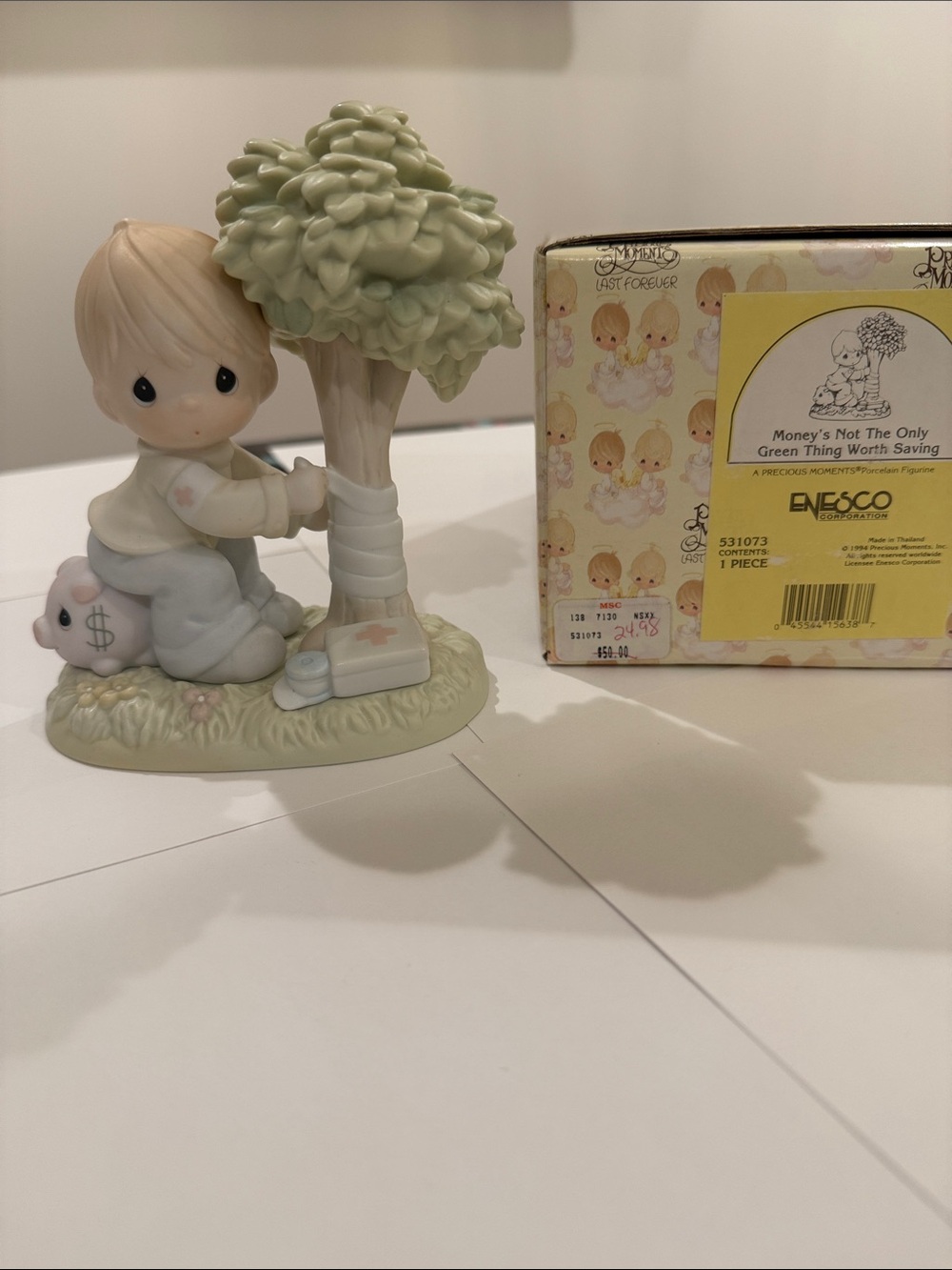 Precious Moments Figurine with Boy Sitting on Pig and Tree